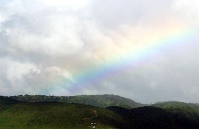 Faint rainbow over the mountain - Dominica