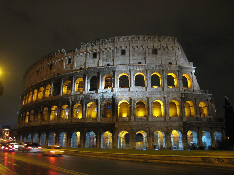 The Colosseum on a rainy night in Rome, Italy