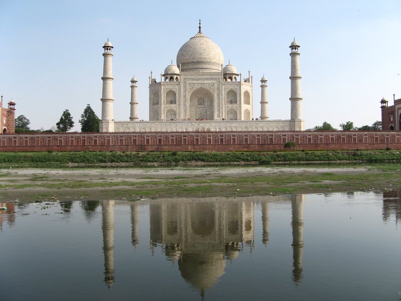 The Taj Mahal reflected in the river Yamuna